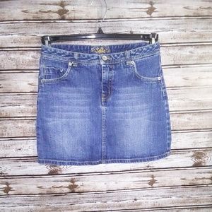 BLUE DENIM SKIRT WITH BUILT IN SHORTS UNDERNEATH.